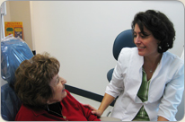 Dr. Wendy Churchill of Churchill Dentistry located in the Carrollwood area of Tampa, FL talks with a patient after a dental cleansing.